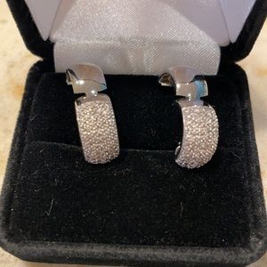 Diamond-accented sterling silver huggie earrings.